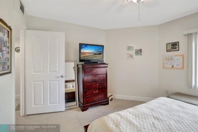 This immaculate corner unit in a newer building of a great 55+ on Flamingo Lakes Country Club in Florida - for sale on GolfHomes.com, golf home, golf lot