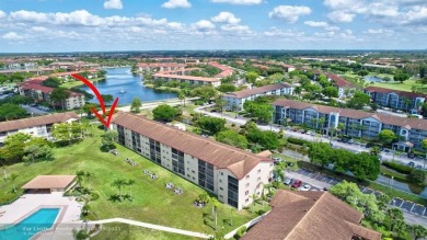 This immaculate corner unit in a newer building of a great 55+ on Flamingo Lakes Country Club in Florida - for sale on GolfHomes.com, golf home, golf lot