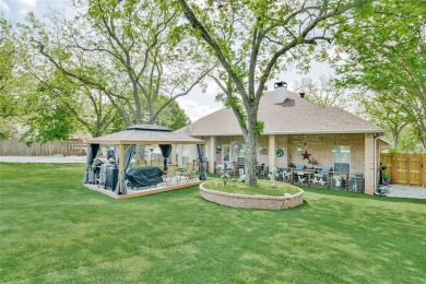Nestled by the serene orchard of Pecan Plantation, this on Pecan Plantation Country Club in Texas - for sale on GolfHomes.com, golf home, golf lot