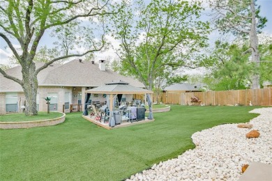 Nestled by the serene orchard of Pecan Plantation, this on Pecan Plantation Country Club in Texas - for sale on GolfHomes.com, golf home, golf lot