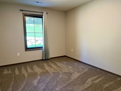 This 3-bedroom, 2-bath condo stands out in the Greater Lakes on Indian Hills Golf Club in Iowa - for sale on GolfHomes.com, golf home, golf lot