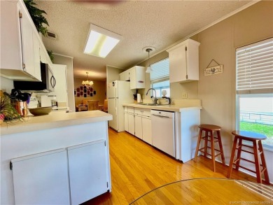Lovely home with a new A/C in 2021. New washer & dryer and on Indianwood Golf and Country Club in Florida - for sale on GolfHomes.com, golf home, golf lot