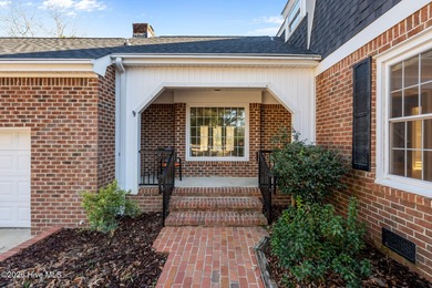 Welcome to this stately brick riverfront home nestled in the on River Bend Golf and Country Club in North Carolina - for sale on GolfHomes.com, golf home, golf lot