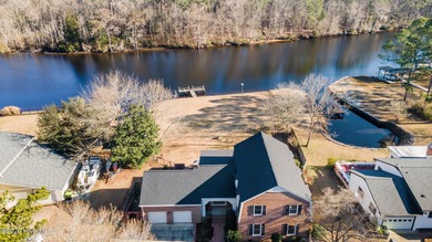 Welcome to this stately brick riverfront home nestled in the on River Bend Golf and Country Club in North Carolina - for sale on GolfHomes.com, golf home, golf lot