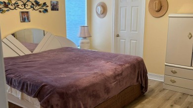 This home has so much to offer!  Pull up to an extended driveway on Sabal Springs Golf and Racquet Club in Florida - for sale on GolfHomes.com, golf home, golf lot