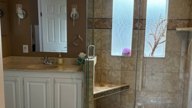 This home has so much to offer!  Pull up to an extended driveway on Sabal Springs Golf and Racquet Club in Florida - for sale on GolfHomes.com, golf home, golf lot