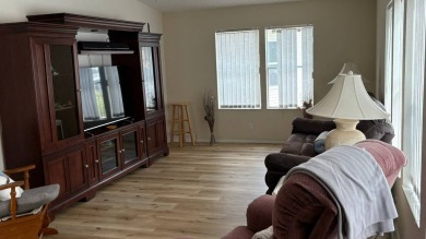 This home has so much to offer!  Pull up to an extended driveway on Sabal Springs Golf and Racquet Club in Florida - for sale on GolfHomes.com, golf home, golf lot