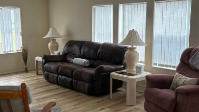 This home has so much to offer!  Pull up to an extended driveway on Sabal Springs Golf and Racquet Club in Florida - for sale on GolfHomes.com, golf home, golf lot