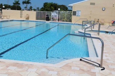 This home has so much to offer!  Pull up to an extended driveway on Sabal Springs Golf and Racquet Club in Florida - for sale on GolfHomes.com, golf home, golf lot