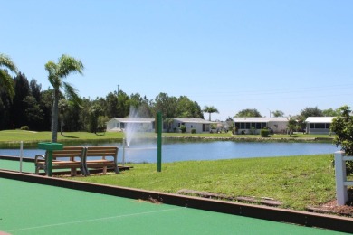 This home has so much to offer!  Pull up to an extended driveway on Sabal Springs Golf and Racquet Club in Florida - for sale on GolfHomes.com, golf home, golf lot