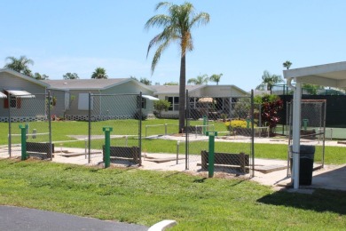 This home has so much to offer!  Pull up to an extended driveway on Sabal Springs Golf and Racquet Club in Florida - for sale on GolfHomes.com, golf home, golf lot