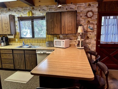 Charming Lake Almanor Country Club Cabin Retreat Escape to this on Lake Almanor Country Club in California - for sale on GolfHomes.com, golf home, golf lot