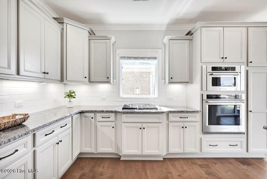 Live the Carolina dream in this all-brick Trusst home perfectly on Compass Pointe Golf Course in North Carolina - for sale on GolfHomes.com, golf home, golf lot