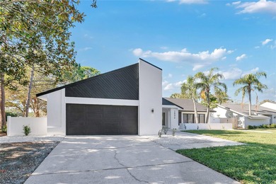 Prepare to be impressed by this fully remodeled Clearwater gem on Countryside Country Club in Florida - for sale on GolfHomes.com, golf home, golf lot