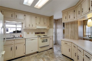 Lots of space in this 2 bedroom/2 full bath 1979 manufactured on Maple Leaf Golf and Country Club in Florida - for sale on GolfHomes.com, golf home, golf lot