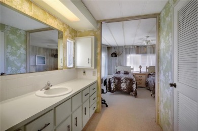 Lots of space in this 2 bedroom/2 full bath 1979 manufactured on Maple Leaf Golf and Country Club in Florida - for sale on GolfHomes.com, golf home, golf lot