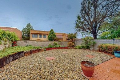 Desirable neighborhood with passive solar townhomes.  This home on Arroyo Del Oso Golf Course in New Mexico - for sale on GolfHomes.com, golf home, golf lot