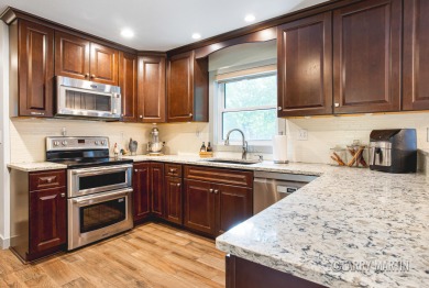 Experience the perfect blend of comfort and style in this on Lake Monterey Golf Club in Michigan - for sale on GolfHomes.com, golf home, golf lot