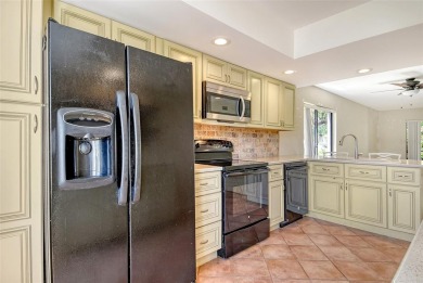 One or more photo(s) has been virtually staged. Tucked away in a on University Park Country Club in Florida - for sale on GolfHomes.com, golf home, golf lot