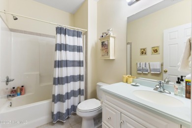 This charming Charleston-style home in the desirable Sea Trail on Sea Trail Golf Resort in North Carolina - for sale on GolfHomes.com, golf home, golf lot