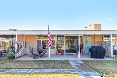 Beautifuly maintained home with picture windows to covered patio on Yuma Golf and Country Club in Arizona - for sale on GolfHomes.com, golf home, golf lot