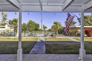 Beautifuly maintained home with picture windows to covered patio on Yuma Golf and Country Club in Arizona - for sale on GolfHomes.com, golf home, golf lot