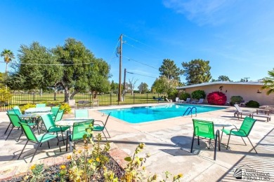 Beautifuly maintained home with picture windows to covered patio on Yuma Golf and Country Club in Arizona - for sale on GolfHomes.com, golf home, golf lot