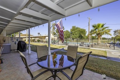 Beautifuly maintained home with picture windows to covered patio on Yuma Golf and Country Club in Arizona - for sale on GolfHomes.com, golf home, golf lot