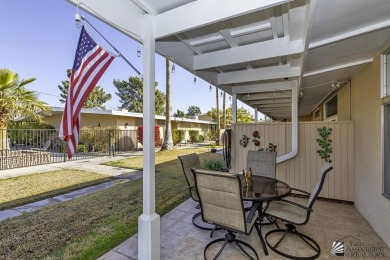 Beautifuly maintained home with picture windows to covered patio on Yuma Golf and Country Club in Arizona - for sale on GolfHomes.com, golf home, golf lot