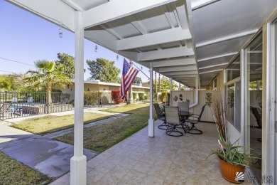 Beautifuly maintained home with picture windows to covered patio on Yuma Golf and Country Club in Arizona - for sale on GolfHomes.com, golf home, golf lot