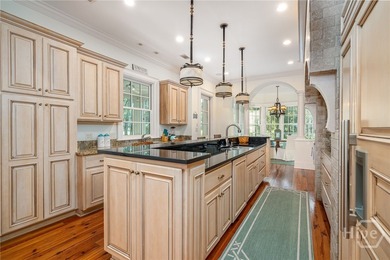 Tucked deep within the Ford Field & River Club, this estate on The Ford Field and River Club  in Georgia - for sale on GolfHomes.com, golf home, golf lot