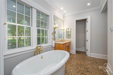 Tucked deep within the Ford Field & River Club, this estate on The Ford Field and River Club  in Georgia - for sale on GolfHomes.com, golf home, golf lot