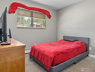 Discover this cozy, meticulously maintained 2-bedroom, 1-bath on Lake Estes Golf Course in Colorado - for sale on GolfHomes.com, golf home, golf lot
