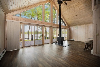 STUNNING WATERFRONT LAKE HOME! This remarkable lakefront on Garland Resort and Golf Club  in Michigan - for sale on GolfHomes.com, golf home, golf lot