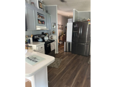 This charming 1996 2-bedroom Palm Harbor home is a must-see! on Schalamar Creek Golf and Country Club in Florida - for sale on GolfHomes.com, golf home, golf lot