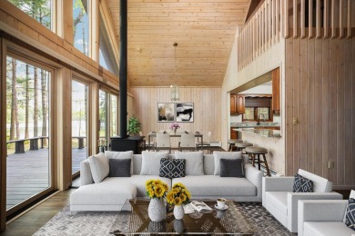 STUNNING WATERFRONT LAKE HOME! This remarkable lakefront on Garland Resort and Golf Club  in Michigan - for sale on GolfHomes.com, golf home, golf lot