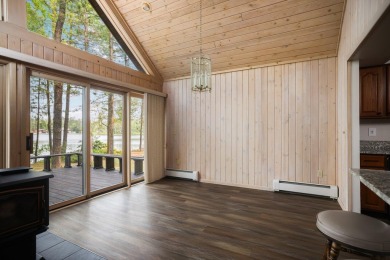 STUNNING WATERFRONT LAKE HOME! This remarkable lakefront on Garland Resort and Golf Club  in Michigan - for sale on GolfHomes.com, golf home, golf lot