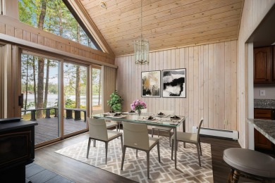 STUNNING WATERFRONT LAKE HOME! This remarkable lakefront on Garland Resort and Golf Club  in Michigan - for sale on GolfHomes.com, golf home, golf lot
