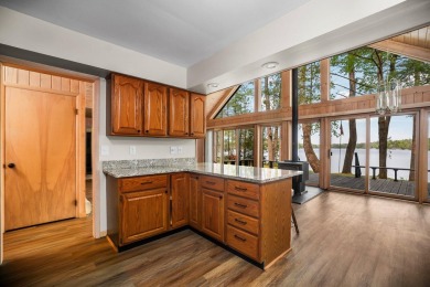 STUNNING WATERFRONT LAKE HOME! This remarkable lakefront on Garland Resort and Golf Club  in Michigan - for sale on GolfHomes.com, golf home, golf lot