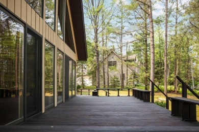 STUNNING WATERFRONT LAKE HOME! This remarkable lakefront on Garland Resort and Golf Club  in Michigan - for sale on GolfHomes.com, golf home, golf lot