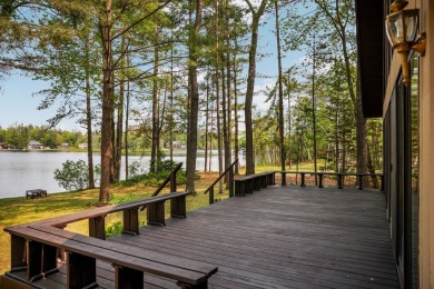 STUNNING WATERFRONT LAKE HOME! This remarkable lakefront on Garland Resort and Golf Club  in Michigan - for sale on GolfHomes.com, golf home, golf lot