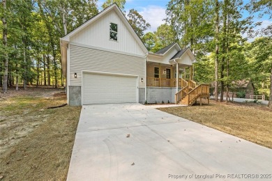 This lovely new construction home is located in the friendly on Carolina Trace Country Club in North Carolina - for sale on GolfHomes.com, golf home, golf lot