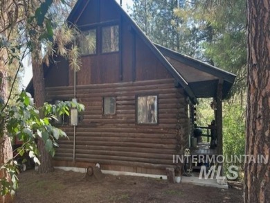 A cozy little log cabin. Two bedrooms, one is in the large open on Terrace Lakes Golf Resort in Idaho - for sale on GolfHomes.com, golf home, golf lot