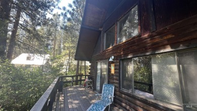 A cozy little log cabin. Two bedrooms, one is in the large open on Terrace Lakes Golf Resort in Idaho - for sale on GolfHomes.com, golf home, golf lot
