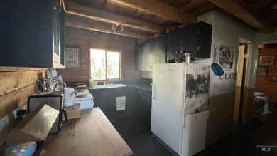 A cozy little log cabin. Two bedrooms, one is in the large open on Terrace Lakes Golf Resort in Idaho - for sale on GolfHomes.com, golf home, golf lot