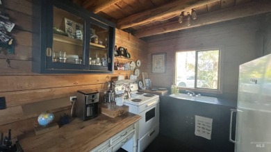 A cozy little log cabin. Two bedrooms, one is in the large open on Terrace Lakes Golf Resort in Idaho - for sale on GolfHomes.com, golf home, golf lot