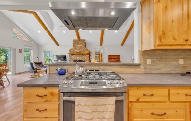 Nestled in the pines on a level two acre lot, this stunning on Lake Almanor West Golf Course in California - for sale on GolfHomes.com, golf home, golf lot