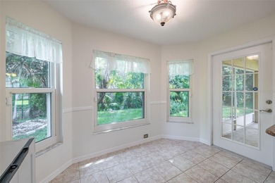 A COZY SPLIT 3-BEDROOM, 2-BATHROOM, 2-CAR GARAGE HOME LOCATED ON on Tampa Bay Golf and Country Club in Florida - for sale on GolfHomes.com, golf home, golf lot