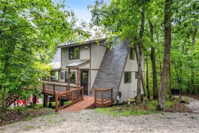 Escape to your own charming A-Frame chalet at Innsbrook Resort on Innsbrook Resort Golf Course in Missouri - for sale on GolfHomes.com, golf home, golf lot