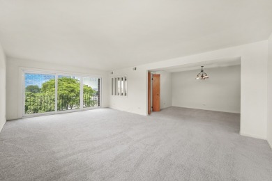 Perched on the top floor at the quiet corner of the building on Arlington Lakes Golf Club in Illinois - for sale on GolfHomes.com, golf home, golf lot